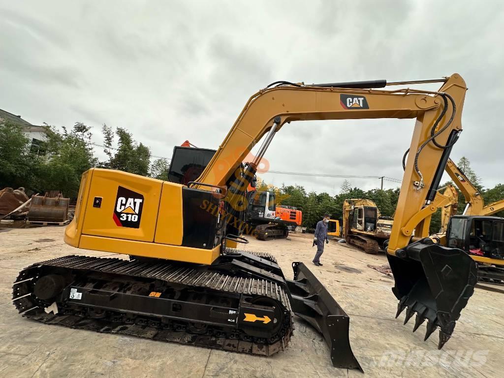 CAT 310 Rupsgraafmachines