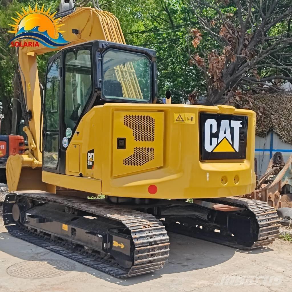 CAT 310 Rupsgraafmachines