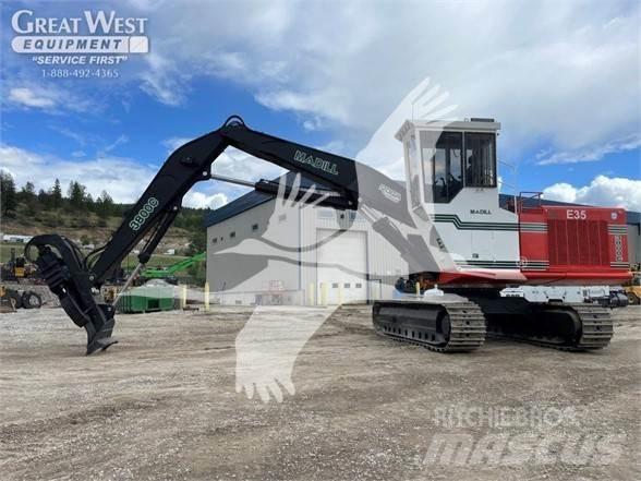 Madill 3800C Boomstamladers