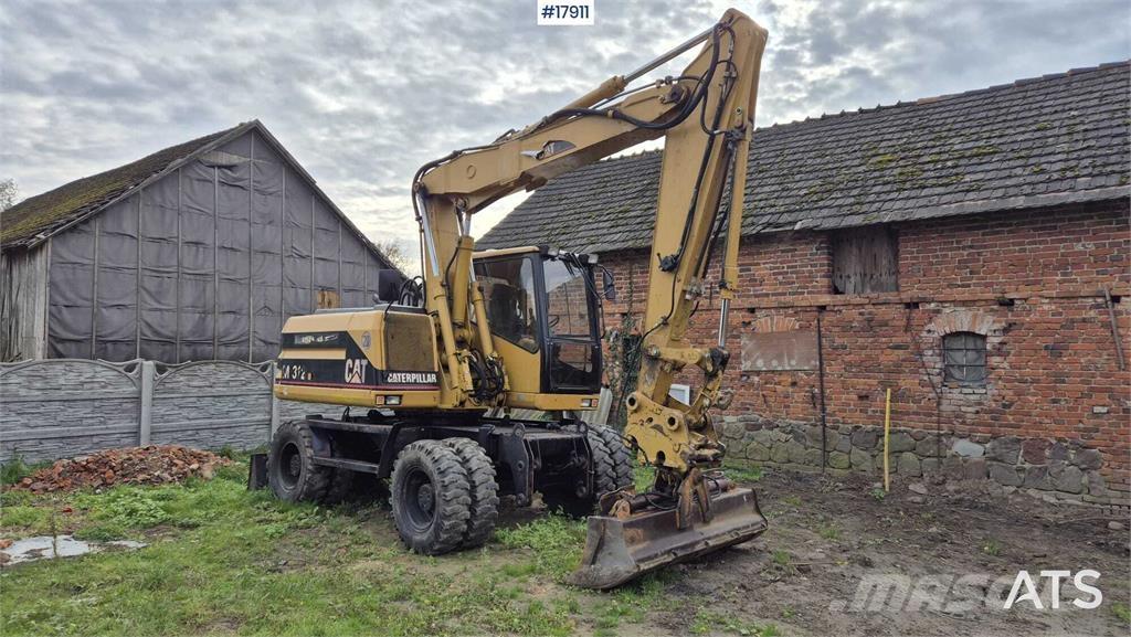 CAT M312 Wielgraafmachines