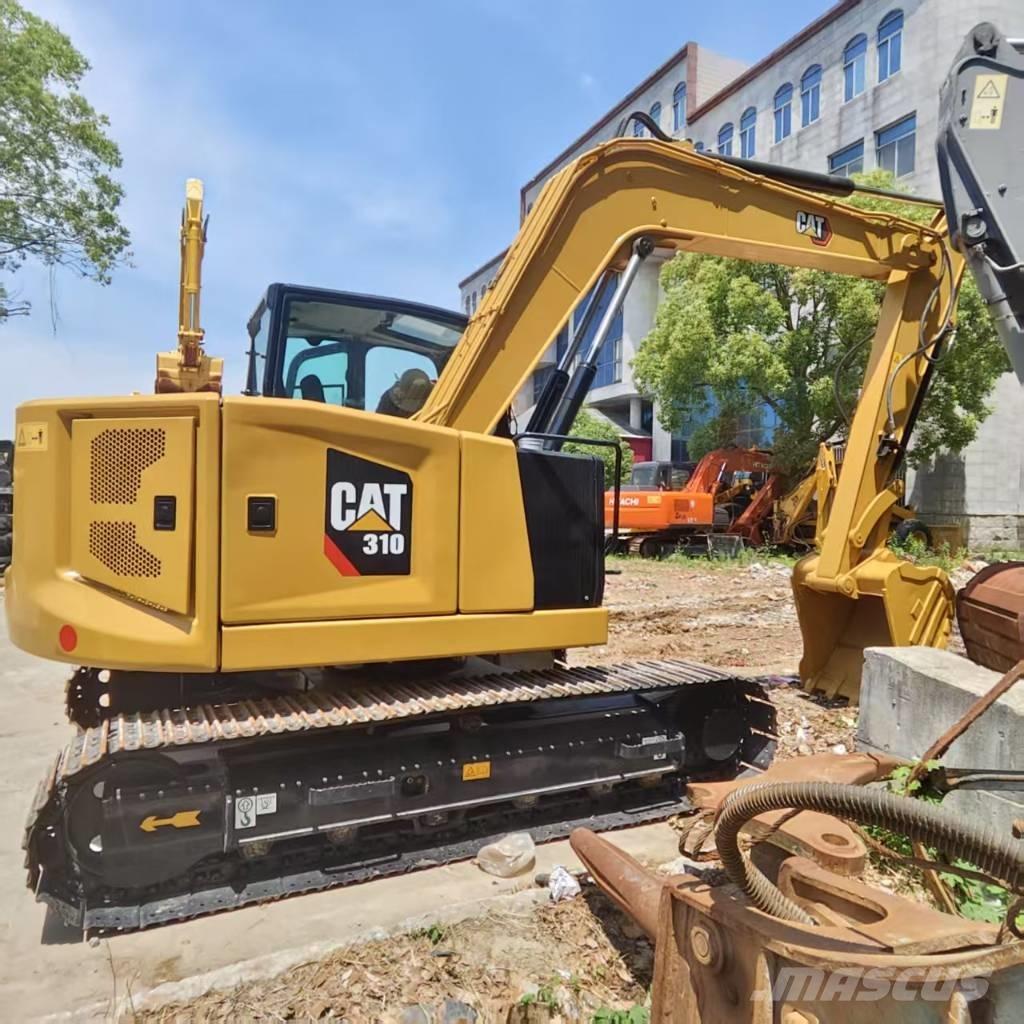 CAT 310 Rupsgraafmachines
