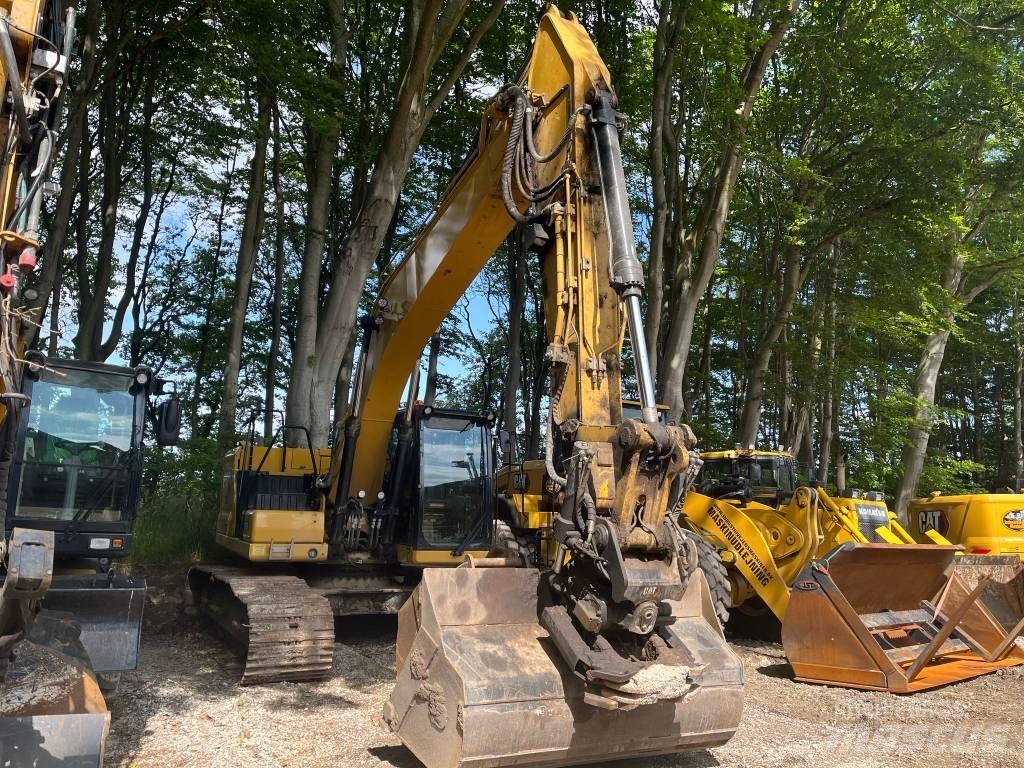 CAT 323 Rupsgraafmachines