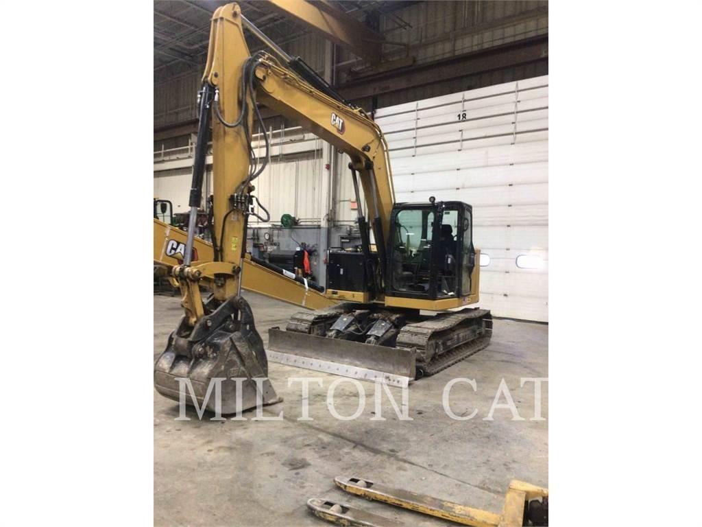 CAT 310 Rupsgraafmachines