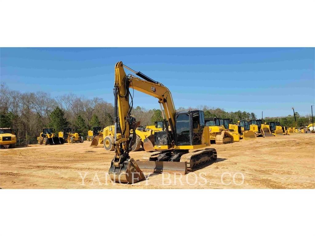 CAT 310 Rupsgraafmachines