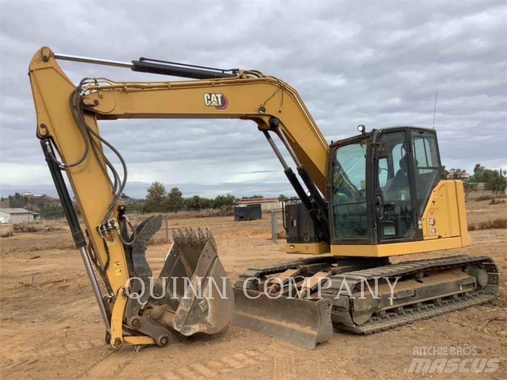 CAT 310 Rupsgraafmachines
