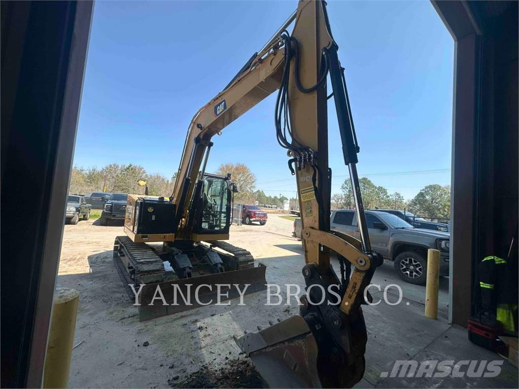 CAT 310 Rupsgraafmachines