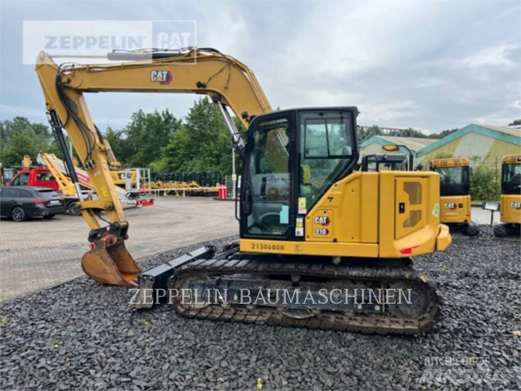CAT 310 Rupsgraafmachines