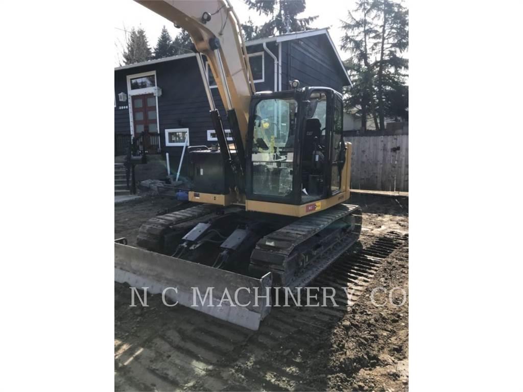 CAT 310 Rupsgraafmachines