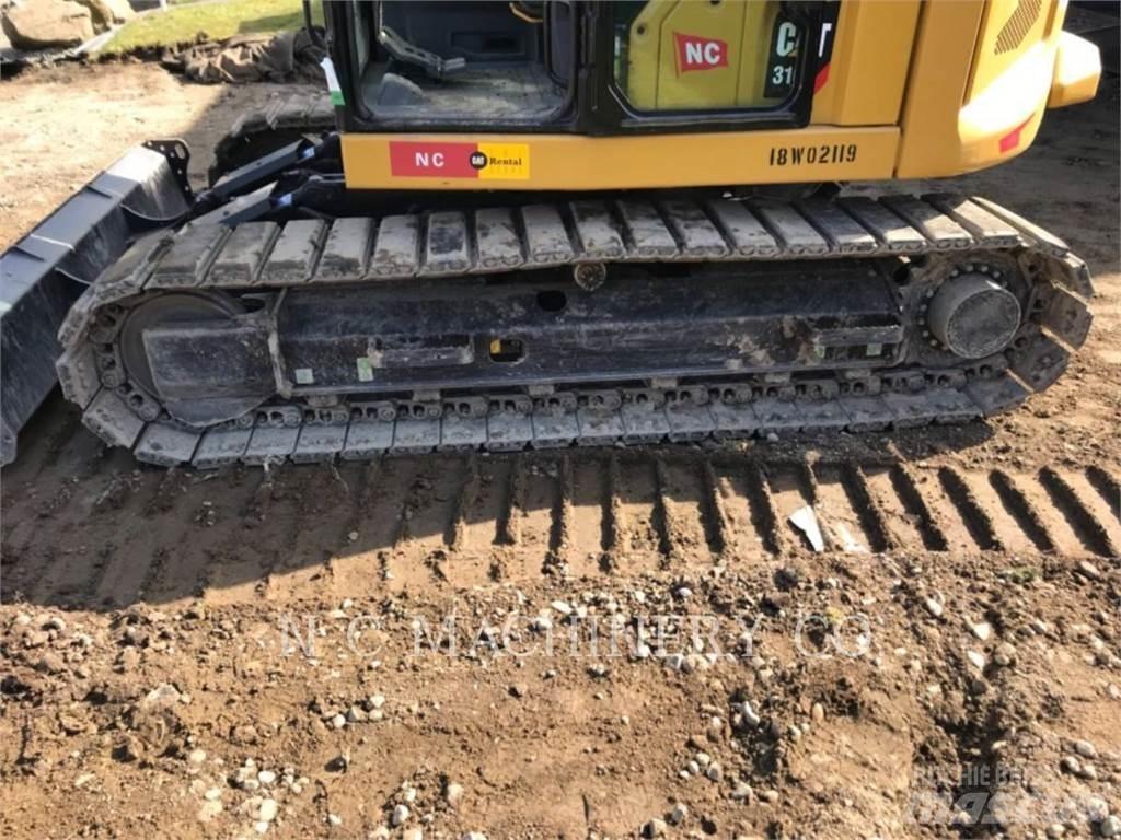 CAT 310 Rupsgraafmachines