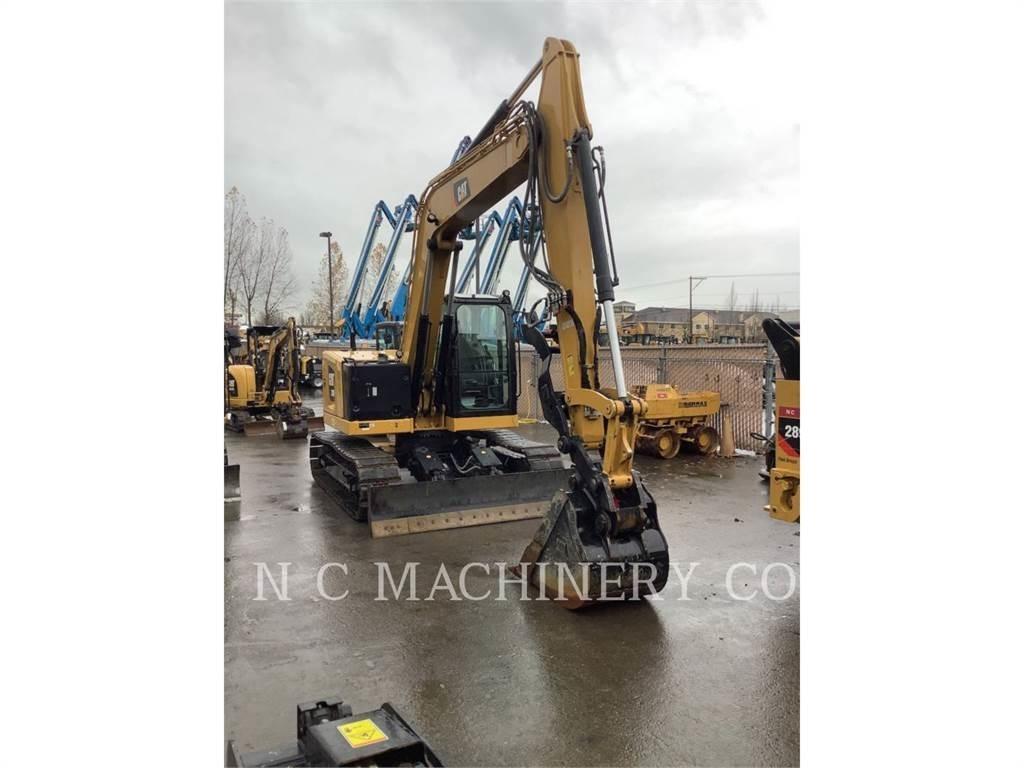 CAT 310 Rupsgraafmachines