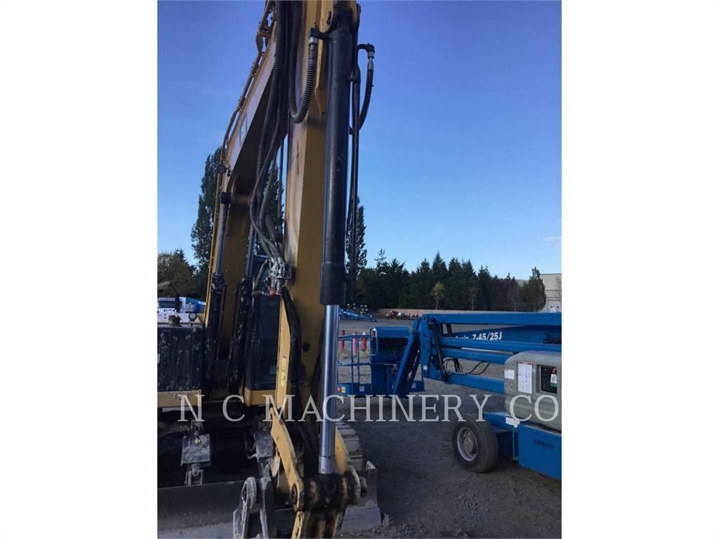 CAT 310 Rupsgraafmachines