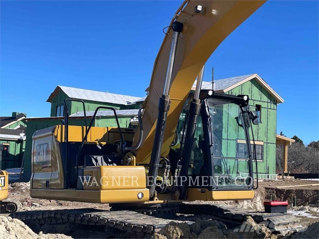 CAT 323 Rupsgraafmachines
