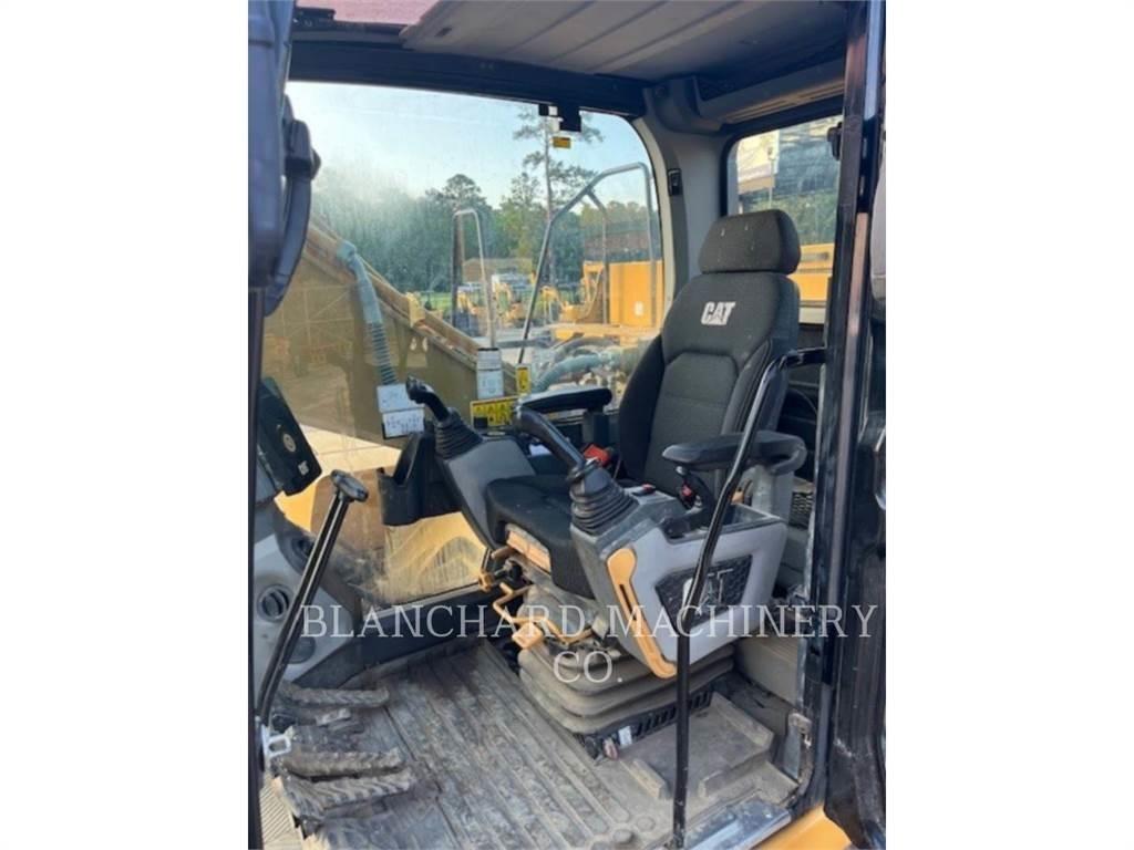 CAT 323 Rupsgraafmachines
