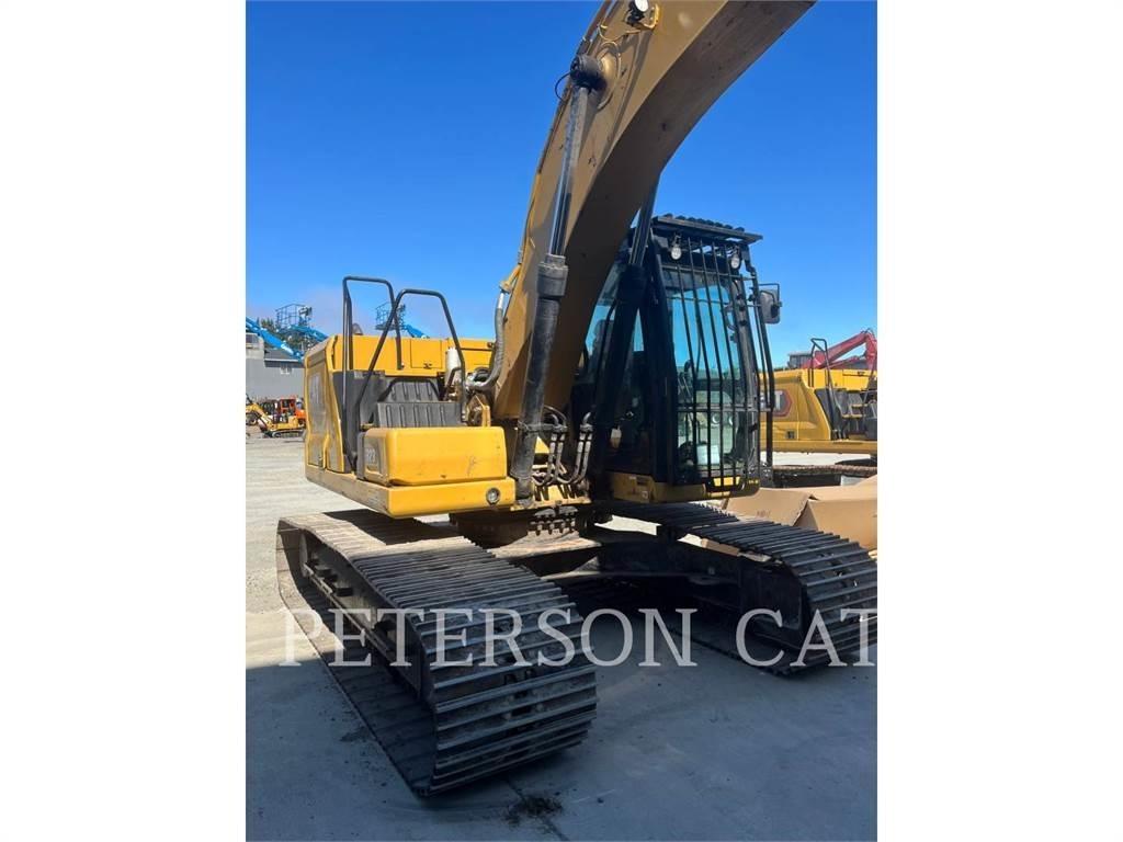 CAT 323 Rupsgraafmachines