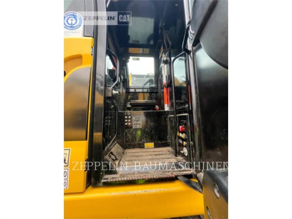 CAT M323F Wielgraafmachines