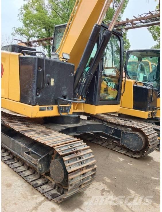 CAT 310 Rupsgraafmachines