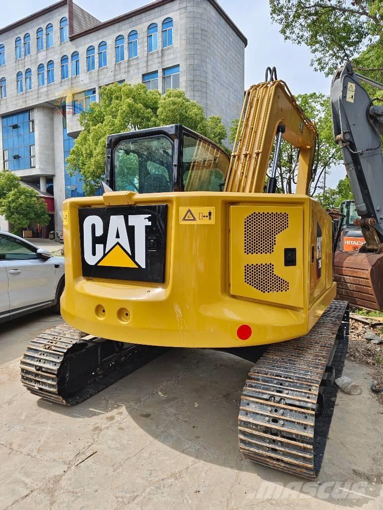 CAT 310 Rupsgraafmachines
