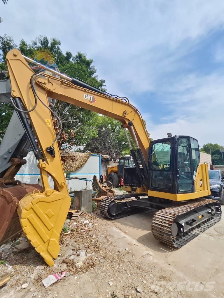 CAT 310 Rupsgraafmachines