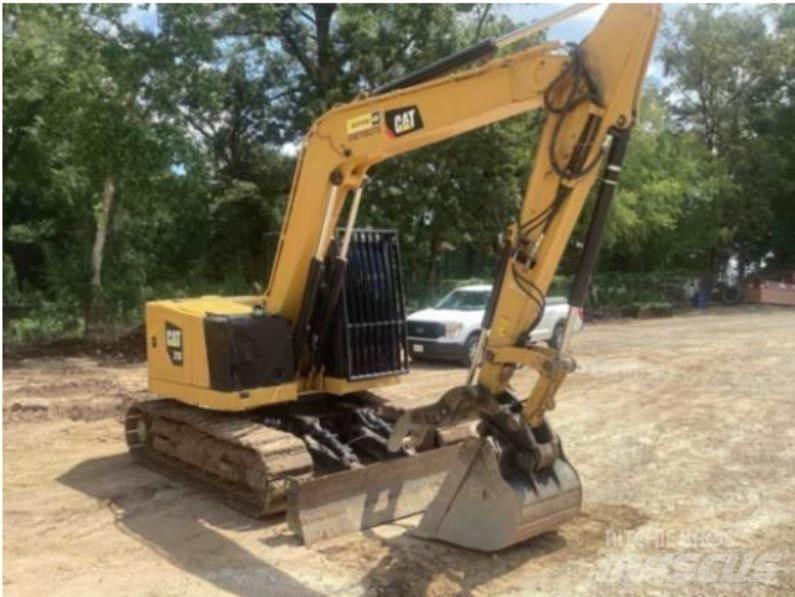 CAT 310 Rupsgraafmachines