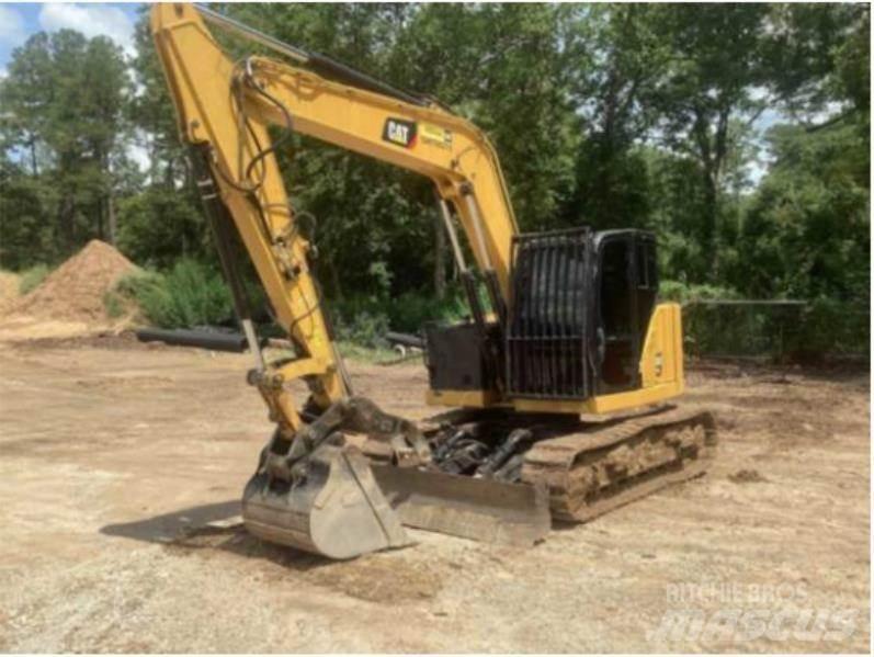 CAT 310 Rupsgraafmachines