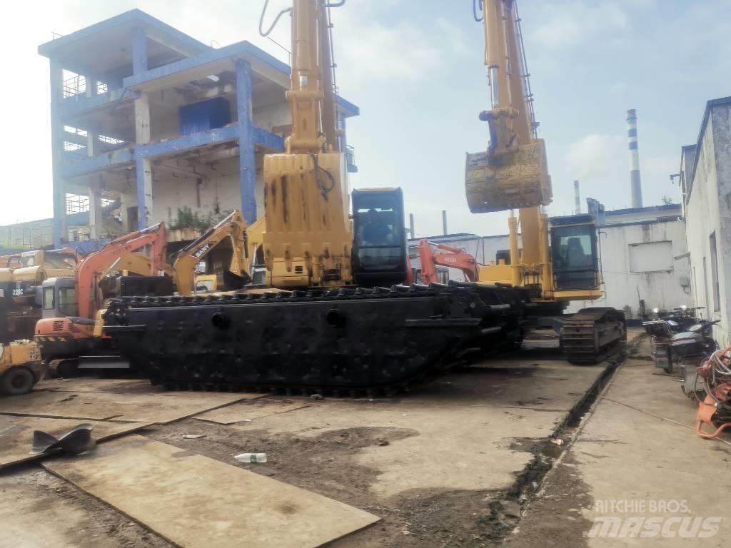 CAT 320 C Amfibische graafmachines
