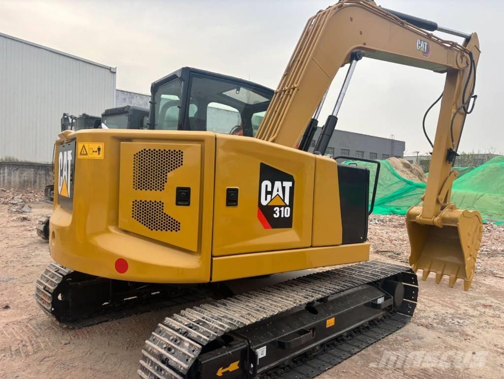 CAT 310 Rupsgraafmachines