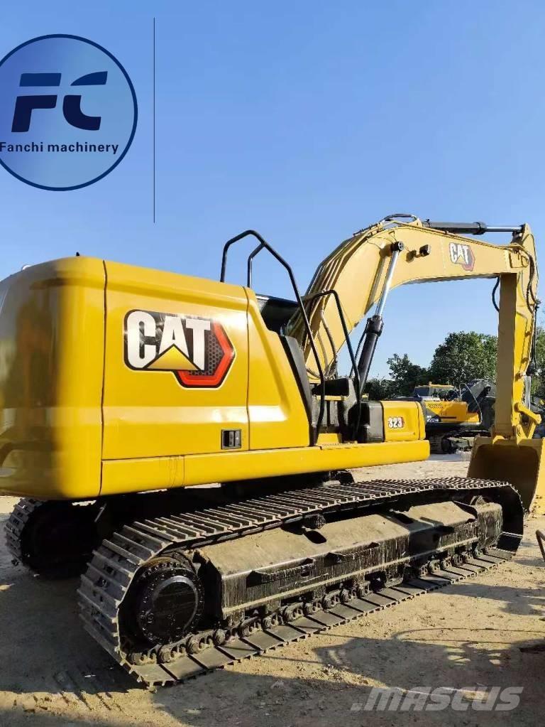 CAT 323 Rupsgraafmachines