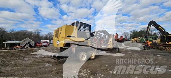 CAT 559C Boomstamladers