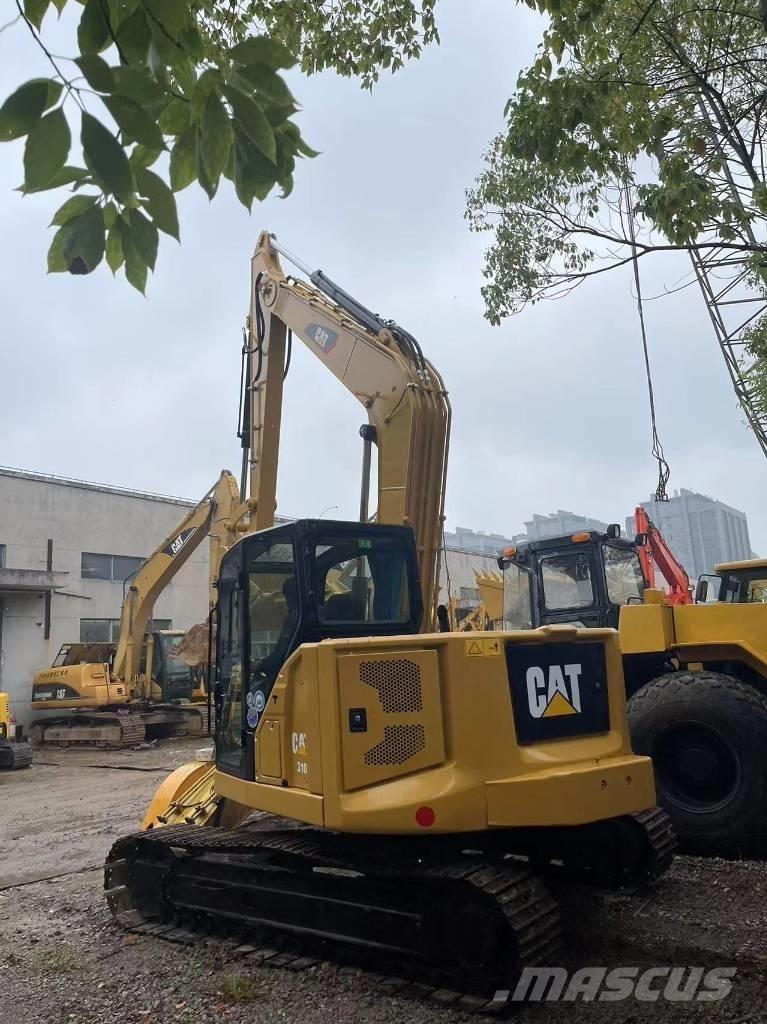 CAT 310 Rupsgraafmachines