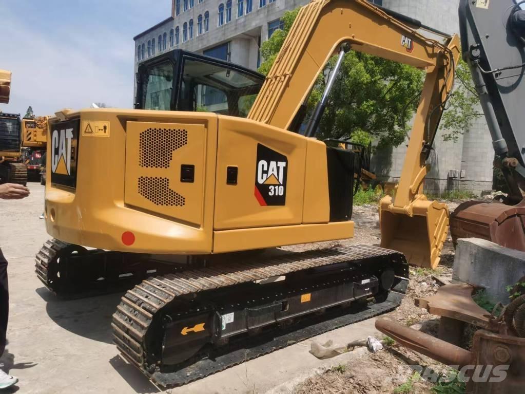CAT 310 Rupsgraafmachines