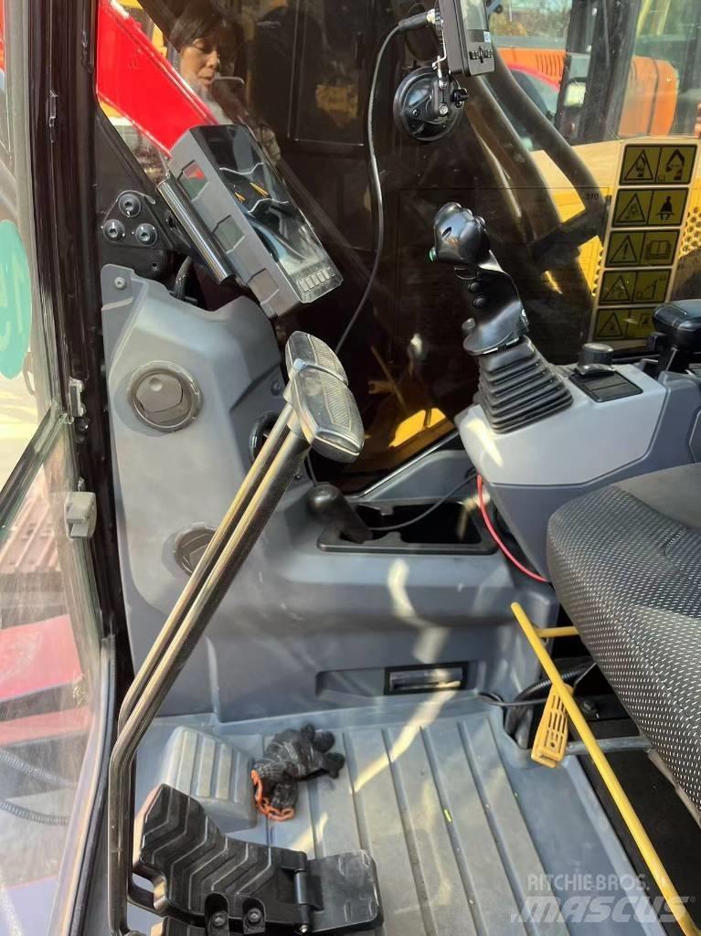 CAT 310 Rupsgraafmachines