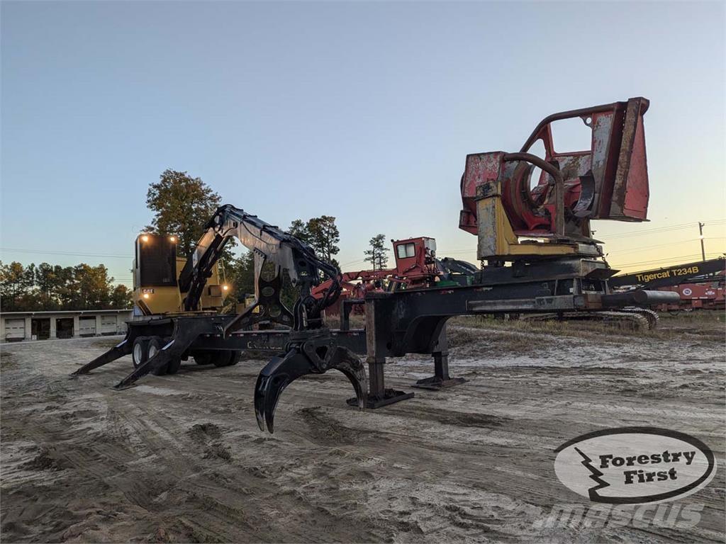 CAT 559C Boomstamladers