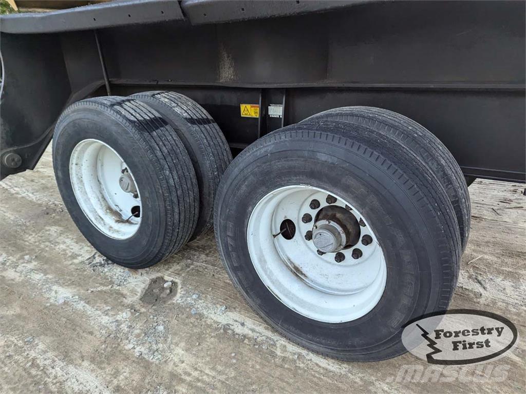 CAT 559C Boomstamladers