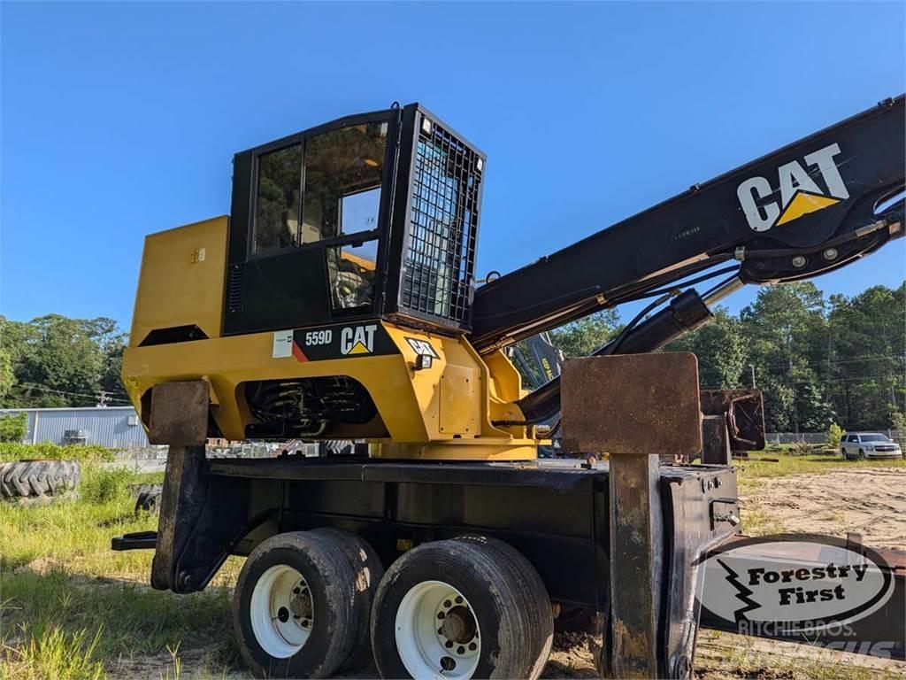 CAT 559D Boomstamladers