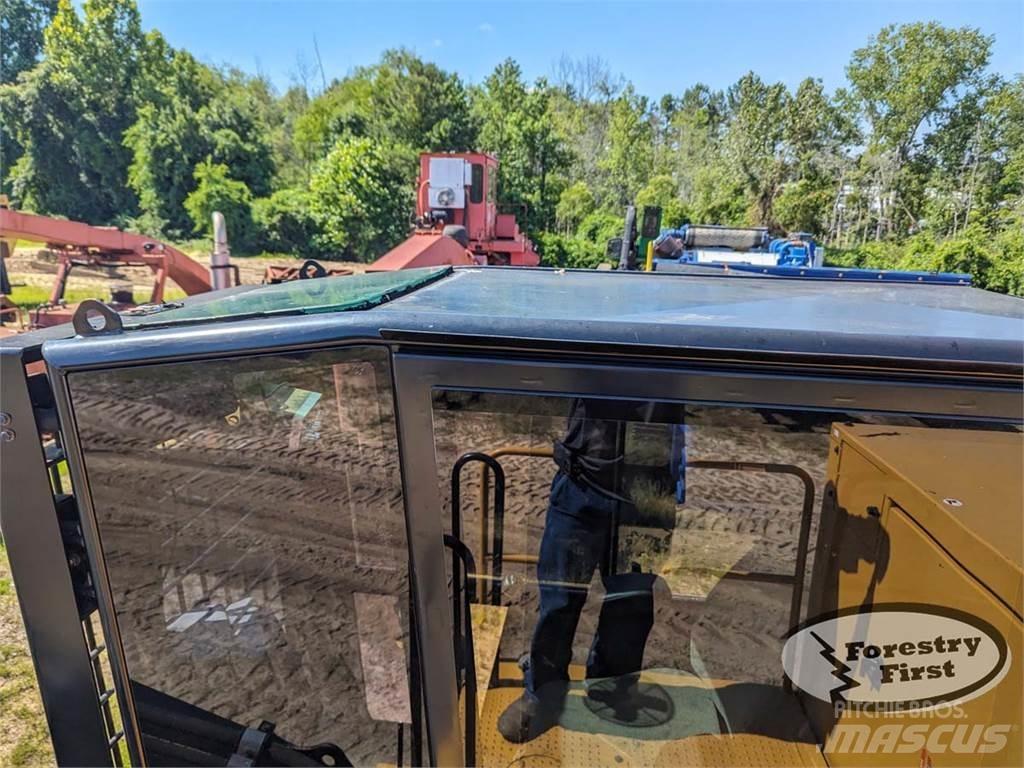 CAT 559D Boomstamladers