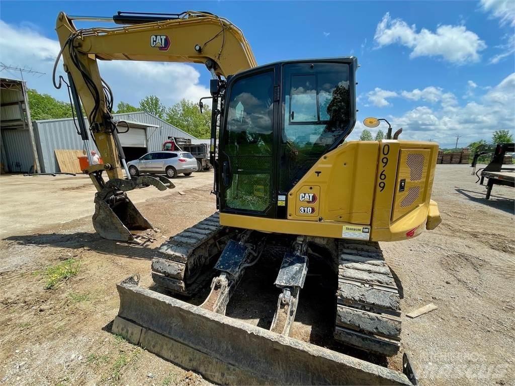 CAT 310 Rupsgraafmachines