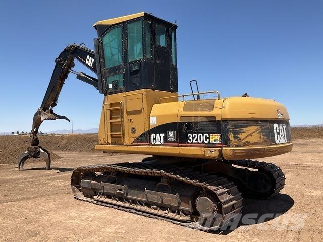 CAT 320C Boomstamladers