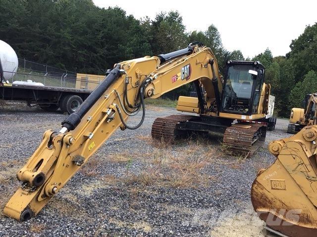 CAT 323 Rupsgraafmachines