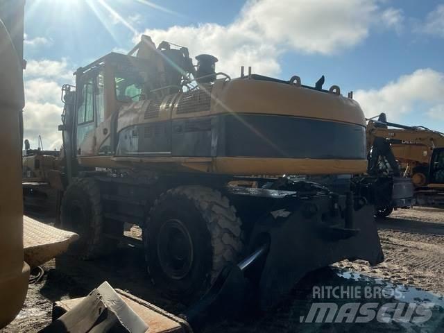 CAT M325CMH Boomstamladers