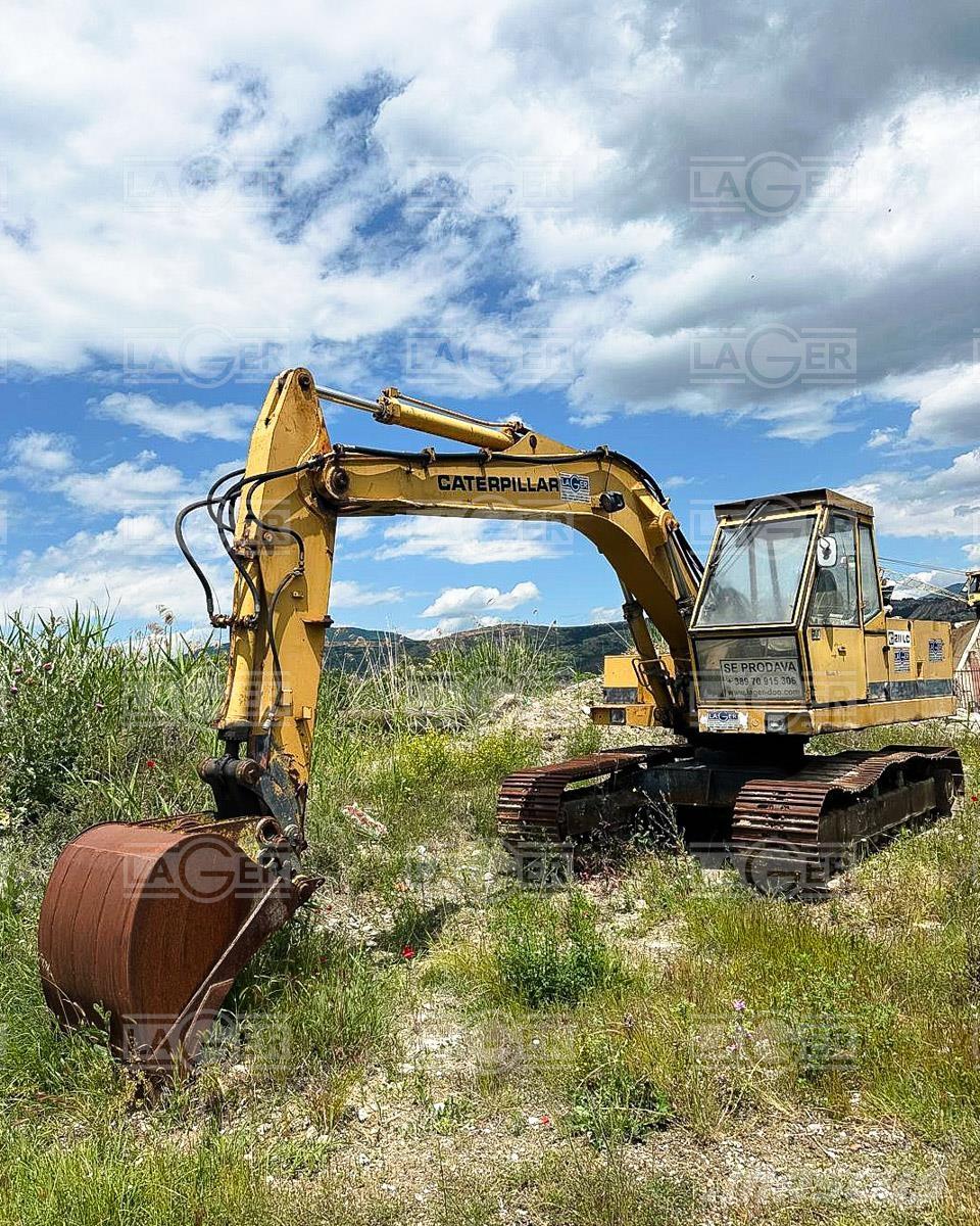 CAT 211 Rupsgraafmachines