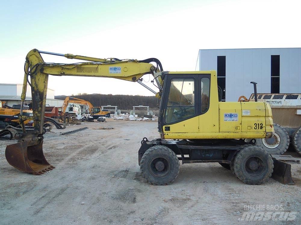 CAT M312 Wielgraafmachines