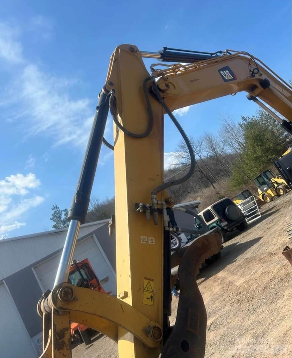 CAT 310 Rupsgraafmachines