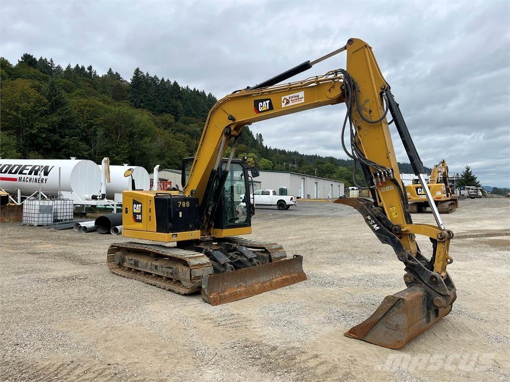 CAT 310 Rupsgraafmachines
