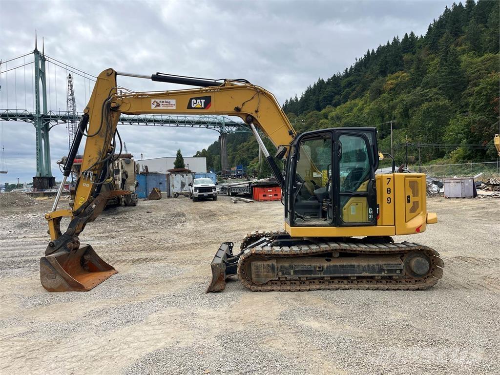 CAT 310 Rupsgraafmachines