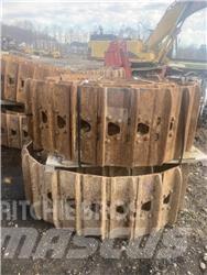 CAT 325 Rupsbanden, kettingen en onderstel