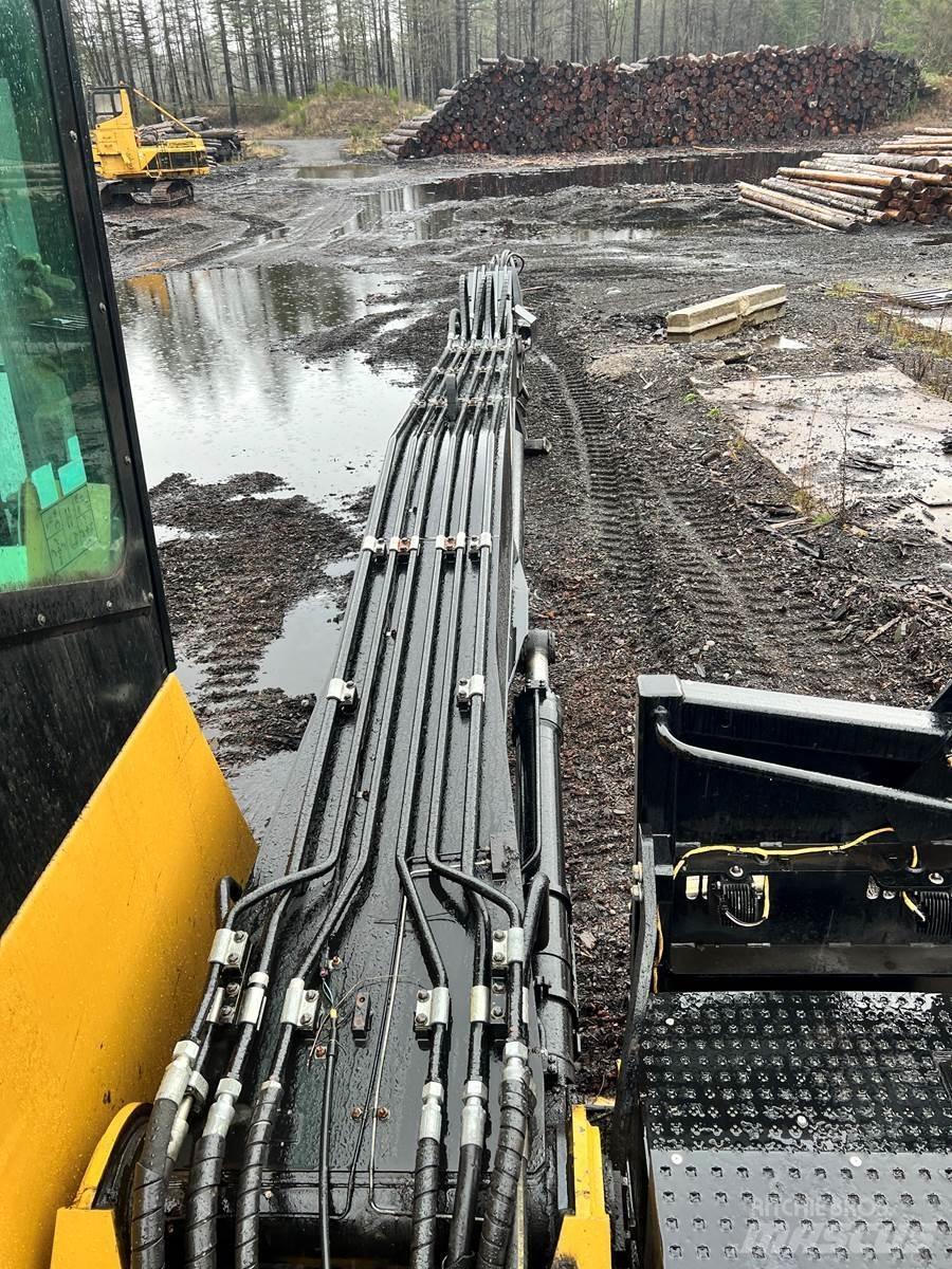 CAT 558LL Boomstamladers