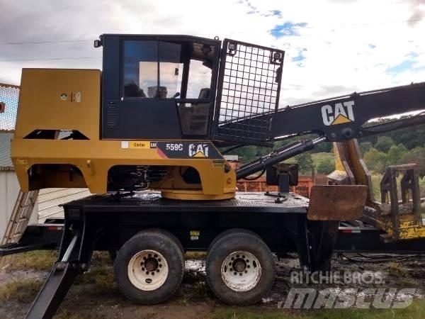 CAT 559C Boomstamladers