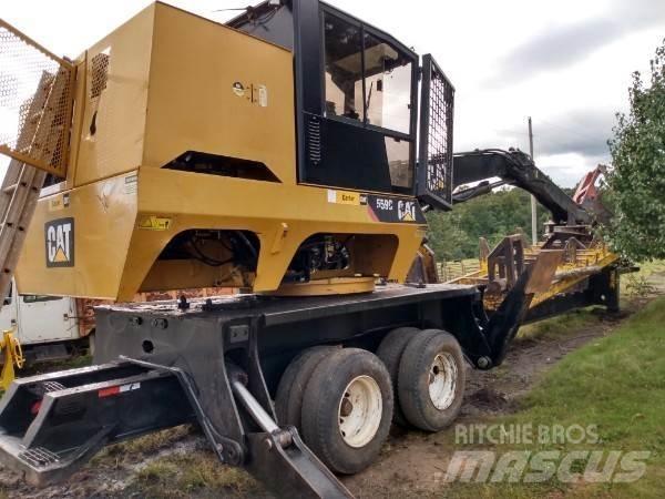 CAT 559C Boomstamladers