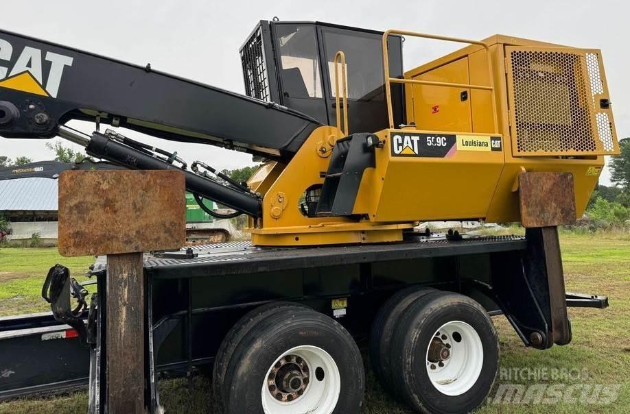 CAT 559C Boomstamladers