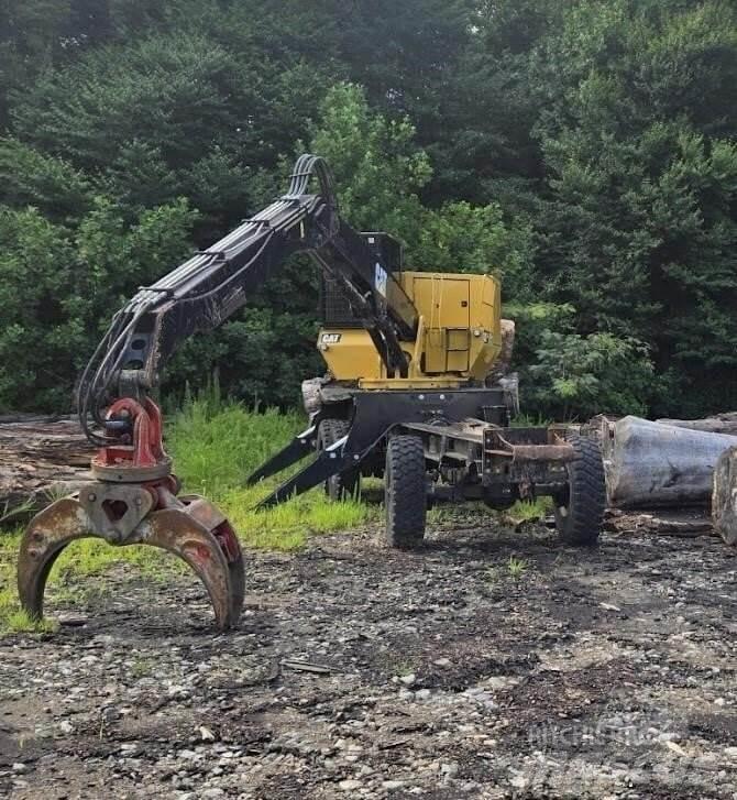 CAT 559C Boomstamladers